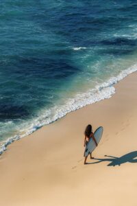 girl walking on seashore sand beach wallpaper