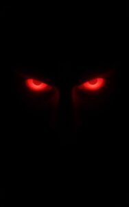 Red evil glowing eyes dark